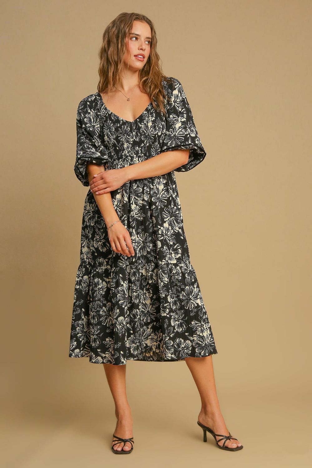 Black and cream floral print V-neck dress with ruffle hem detailing