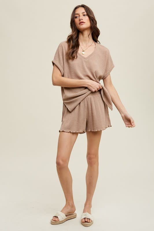 Model wearing mocha colored ribbed knit shorts with a soft textured finish