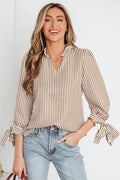 Lightweight seersucker blouse with puff sleeves, tie-up cuffs, and a decorative ruffle collar.