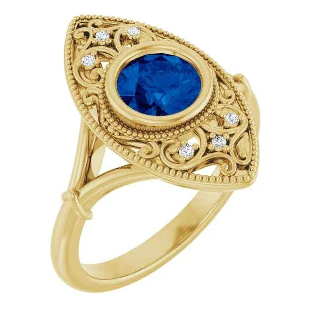 Vintage style blue sapphire ring with intricate gold setting