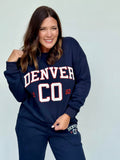 Navy blue crewneck sweatshirt with Denver chenille lettering in white and red.