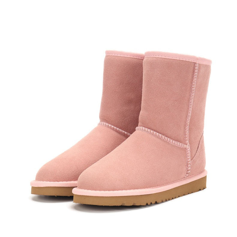 Women's classic warm suede-style snow boots, shown in pink and navy blue variants, featuring a plush lining and durable sole for winter comfort.