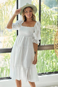 Swiss dot midi dress with tiered skirt and flounce sleeves
