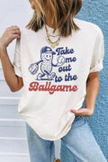 A woman wearing a white graphic t-shirt with Take Me Out To The Ballgame text and a peanut cartoon graphic.
