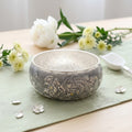 Hand-engraved 999 fine sterling silver bowl with high-relief phoenix and peony blossom motifs.