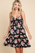 A floral print cami dress featuring romantic frill details and a summer-ready silhouette.