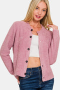 Model wearing a soft pink long sleeve button-down fuzzy knit cardigan