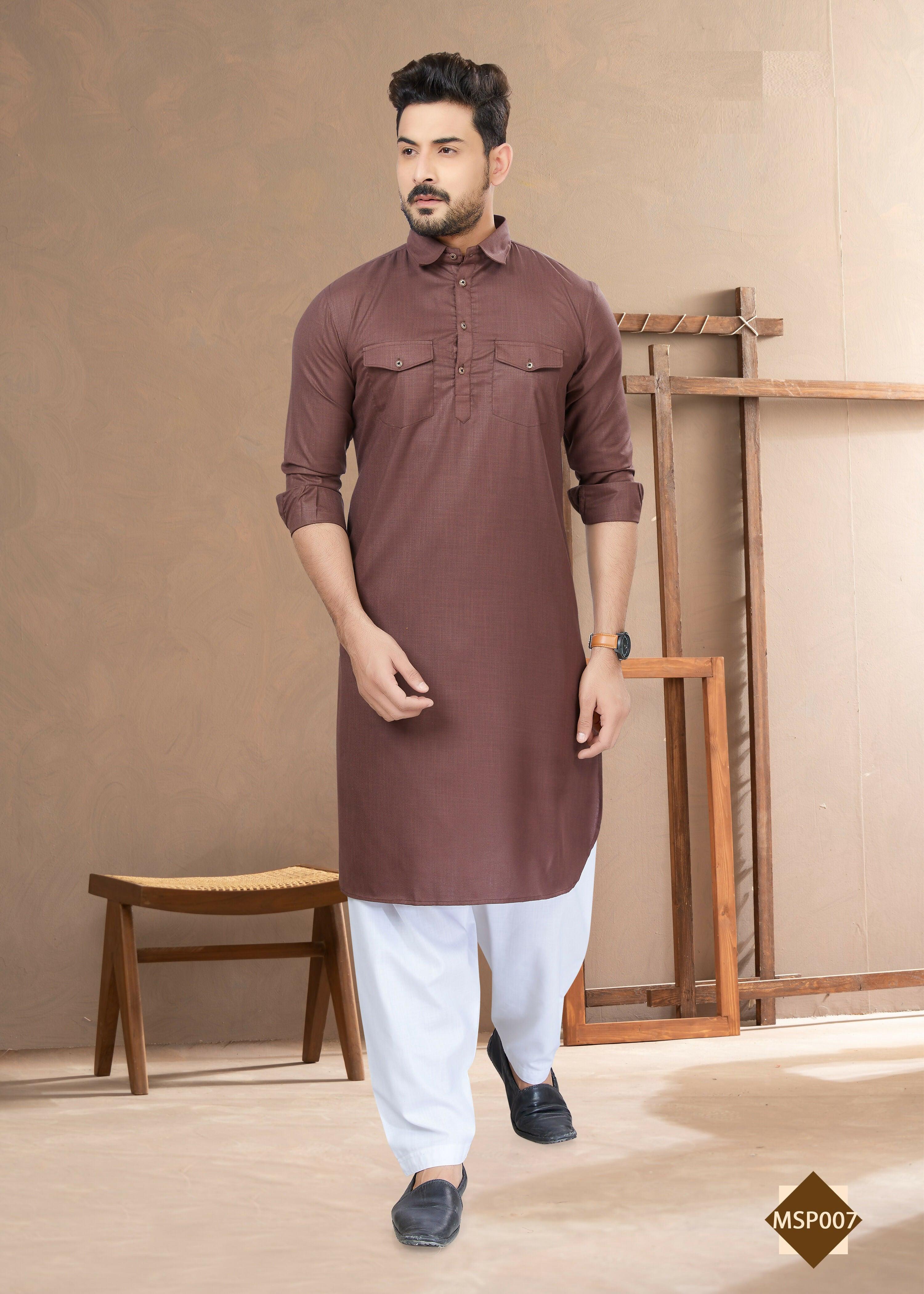 A man wearing a light brown heavy cotton straight kurta pyjama set