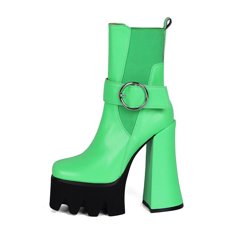 Pair of neon green platform ankle boots with chunky high heels and a silver buckle on a white background.