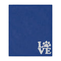 Blue towel with 'LOVE' and paw print design on a white background