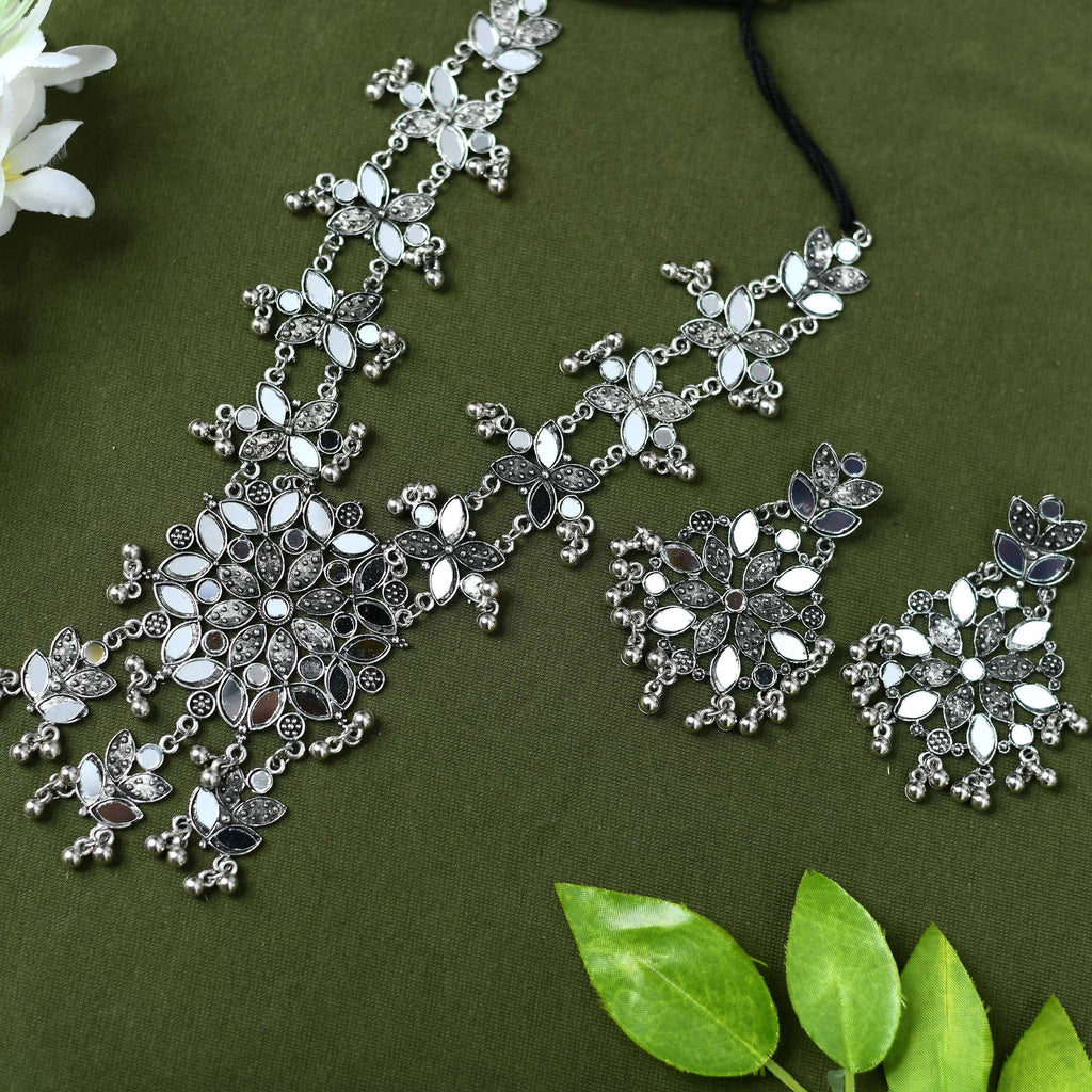 Long oxidised silver-plated necklace set with intricate mirror work and sliding clasp closure