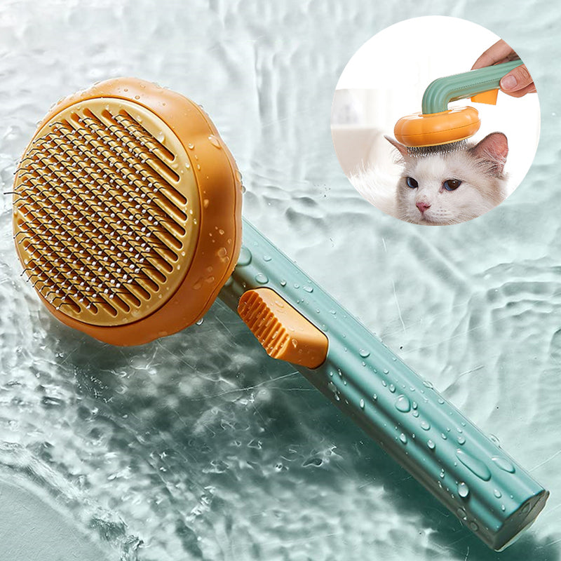 Modern minimalist handheld self-cleaning pet grooming brush in sage green, displayed on a bathroom counter.