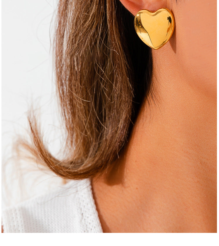 European And American Minimalist Glossy Heart-shaped Stainless Steel Earrings For Women. Light Luxury Minimalist Style. Exaggerated Heart-shaped Earrings. Versatile Accessories.