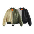 A front-facing view of two colorways of a Harajuku style women's casual patchwork bomber jacket with ribbed trim and zip pocket details.
