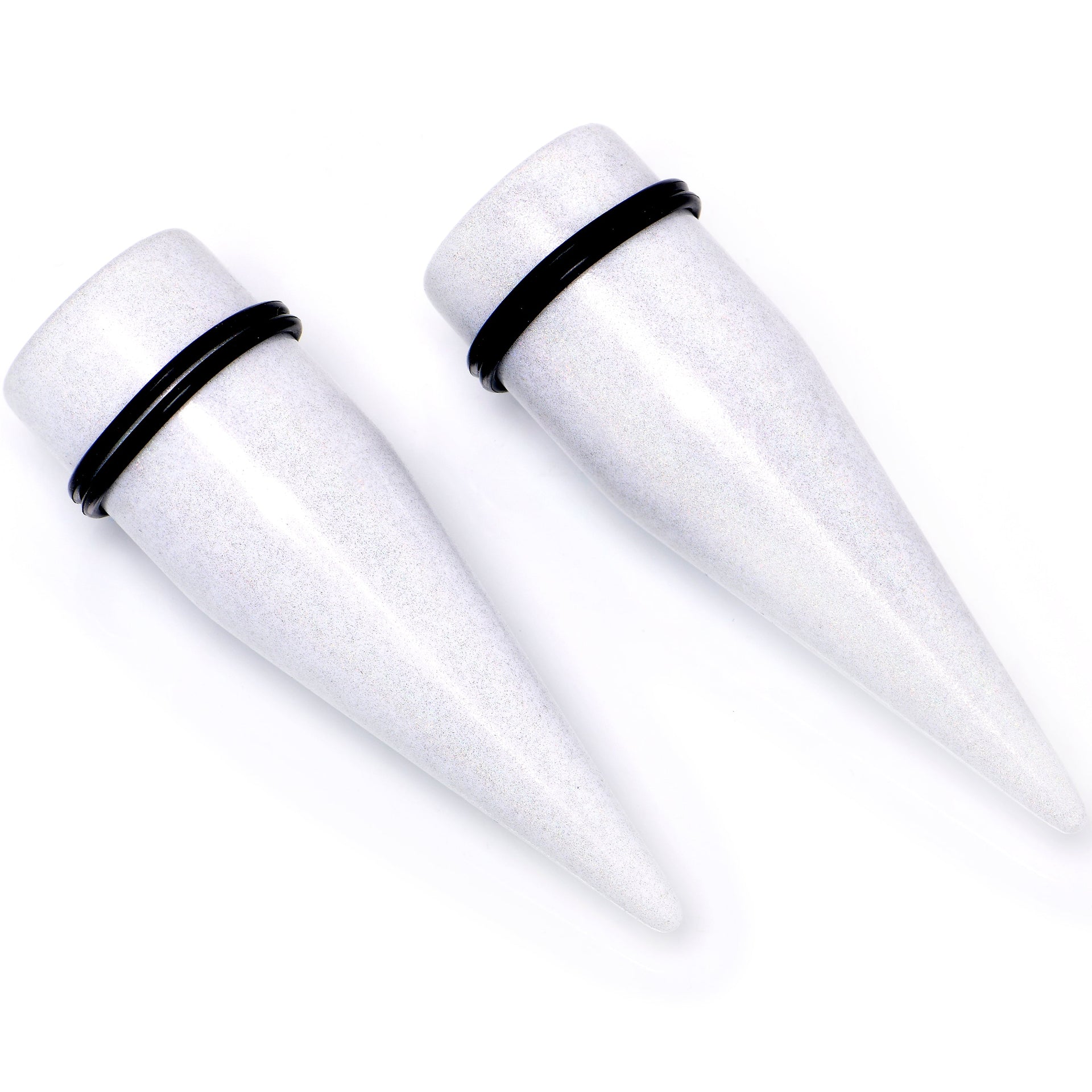 A pair of white shimmer acrylic straight ear tapers with black O-ring rubber bands for ear stretching.