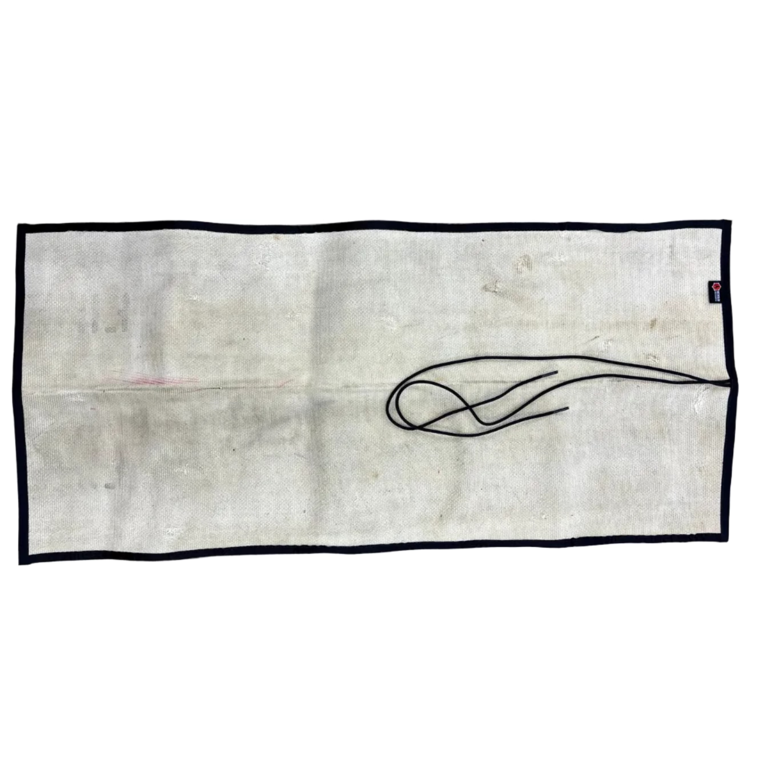 High-visibility yellow fire hose utility mat with black trim on an office desk workspace