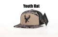 Youth 7 Panel Hardwoods-II snapback hat with 3D puff Buck logo and black mesh back.