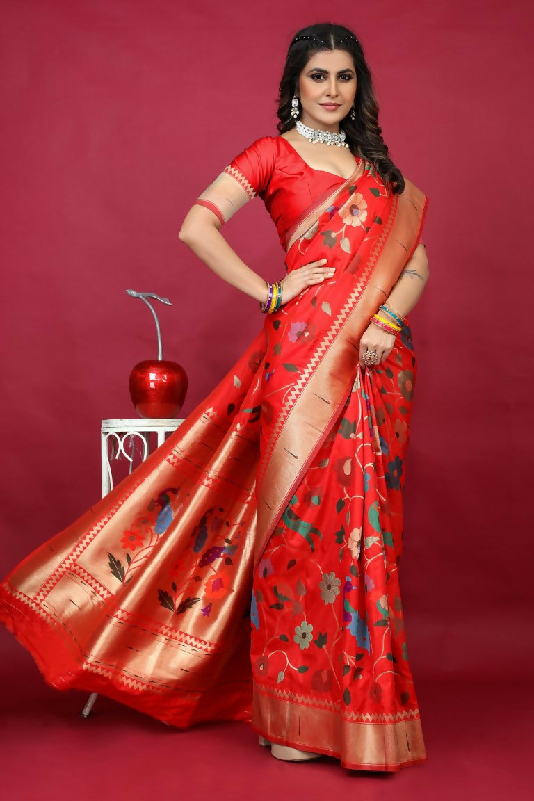 A vibrant red Paithani silk saree featuring intricate gold Zari woven borders and a matching red blouse.
