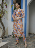 Woman wearing a multicolor pure muslin digital floral print A-line kurta with matching pants in a bohemian casual style