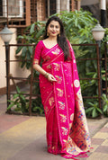 Vibrant rani pink pure silk saree with gold zari woven design and tassel pallu