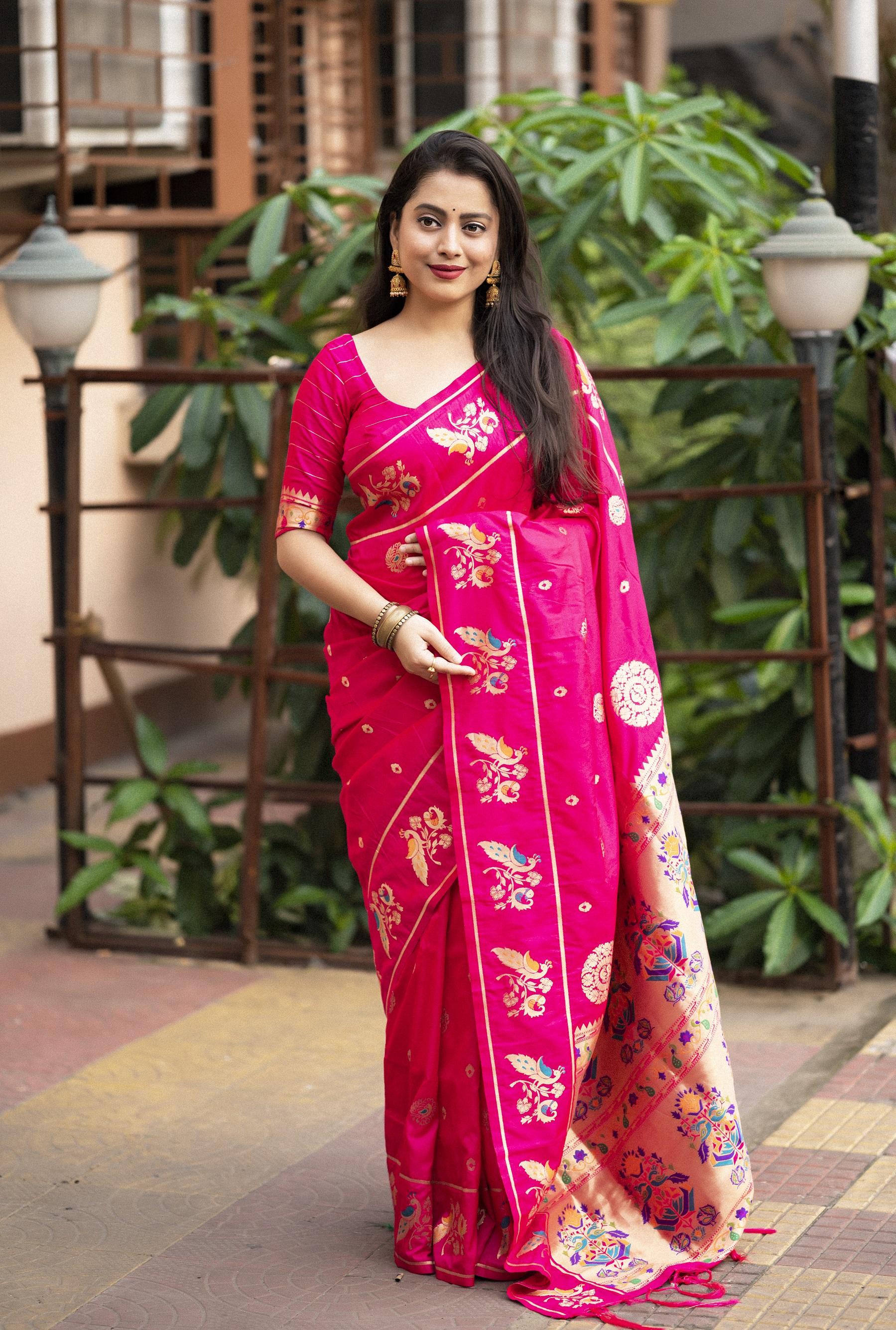 Vibrant rani pink pure silk saree with gold zari woven design and tassel pallu
