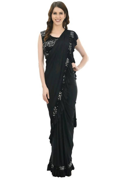 Model wearing a black ruffled ready-to-wear saree with a sequence-embroidered blouse