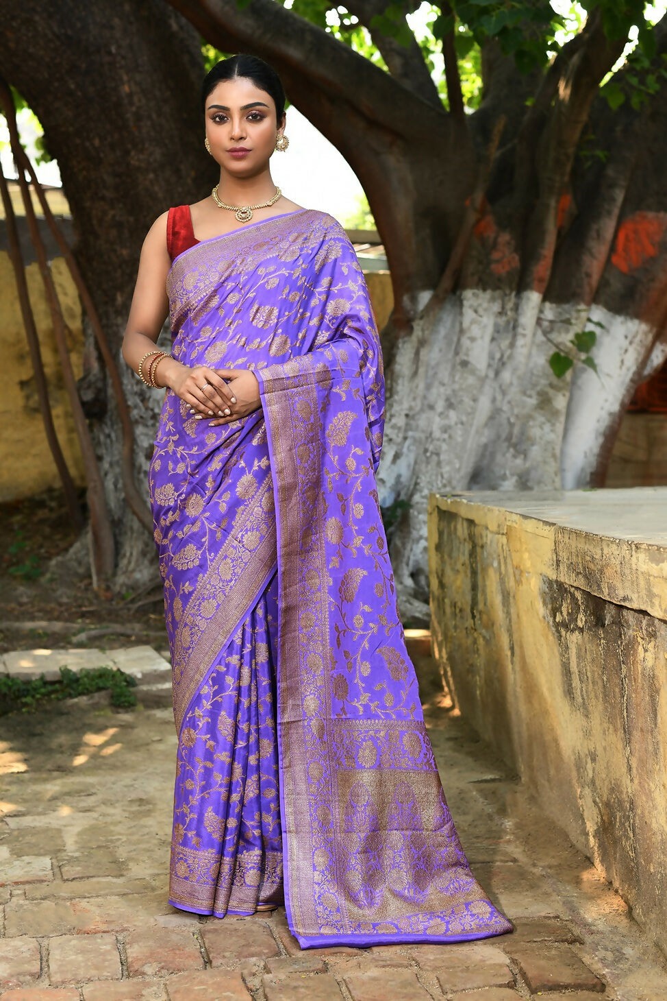 Dark lilac crepe chiffon Banarasi silk saree with a graceful, fluid drape.