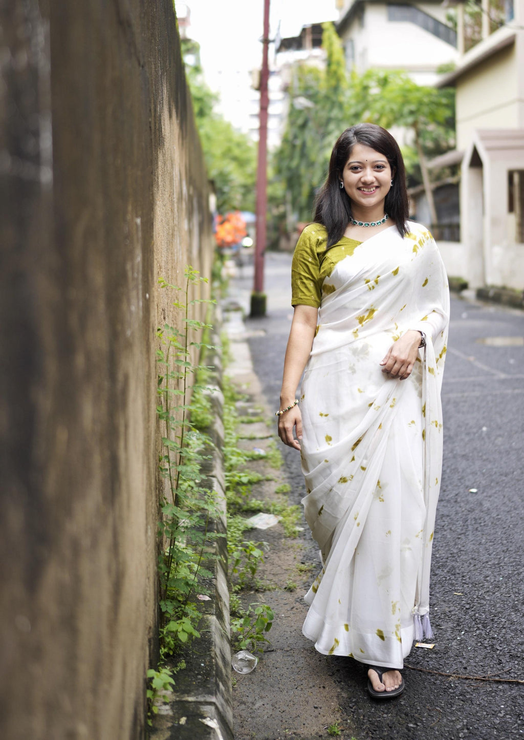 Mehndi green and white tie-dye shibori georgette saree with zari woven chanderi blouse fabric.