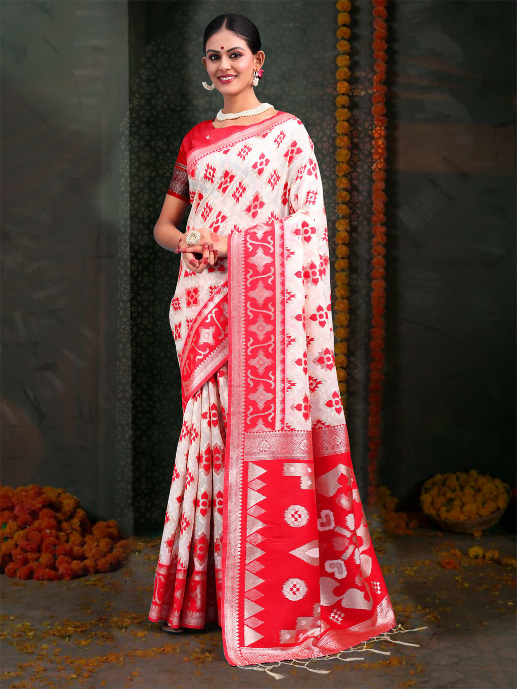 Red and white patterned linen cotton saree with matching blouse fabric.