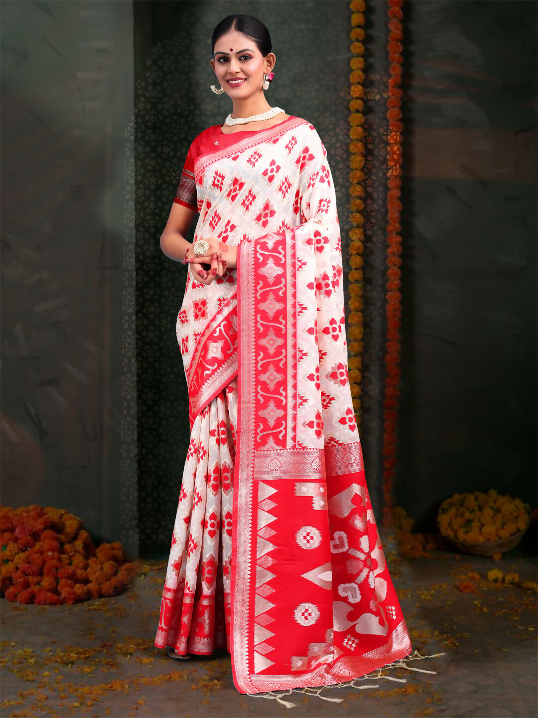 Red and white patterned linen cotton saree with matching blouse fabric.