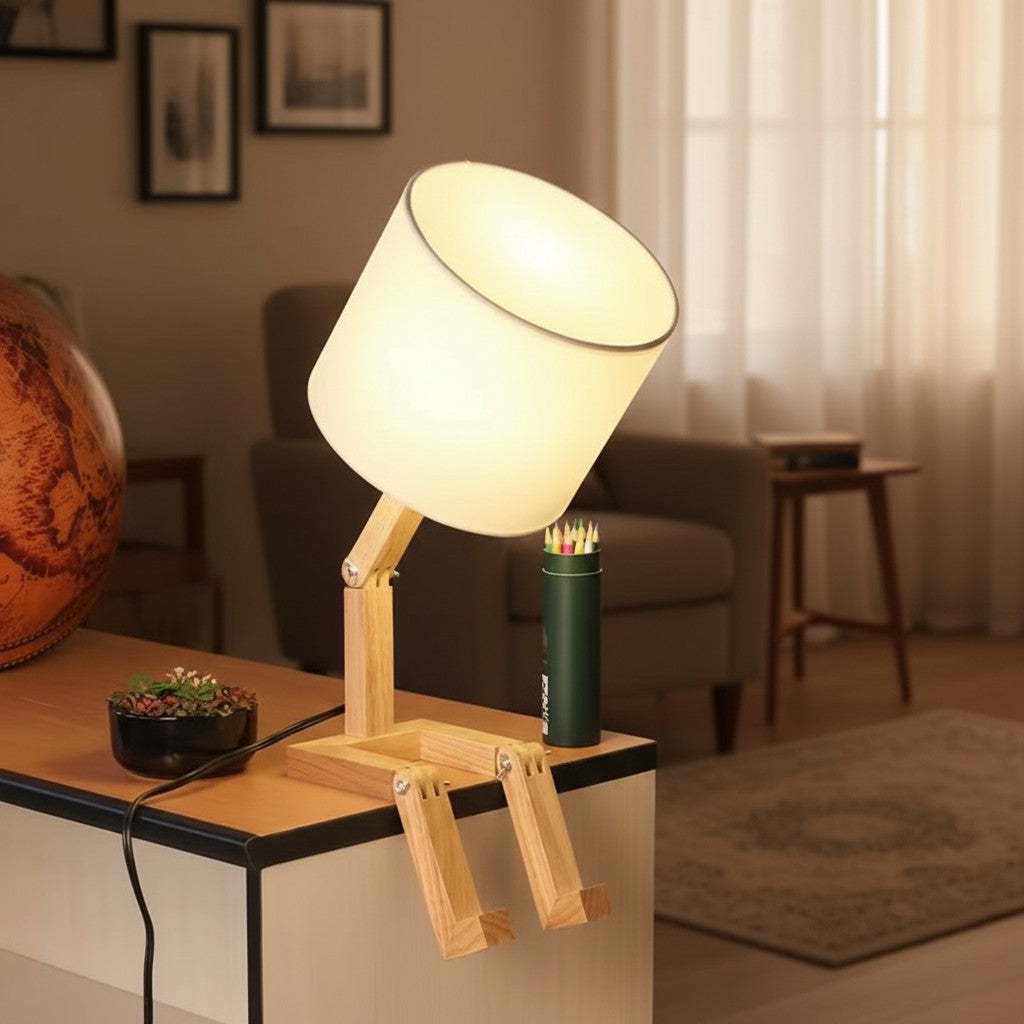 Modern foldable wooden desk lamp with a neutral white shade on a minimalist office desk