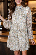Floral print mock neck mini dress with long sleeves in a fitted style