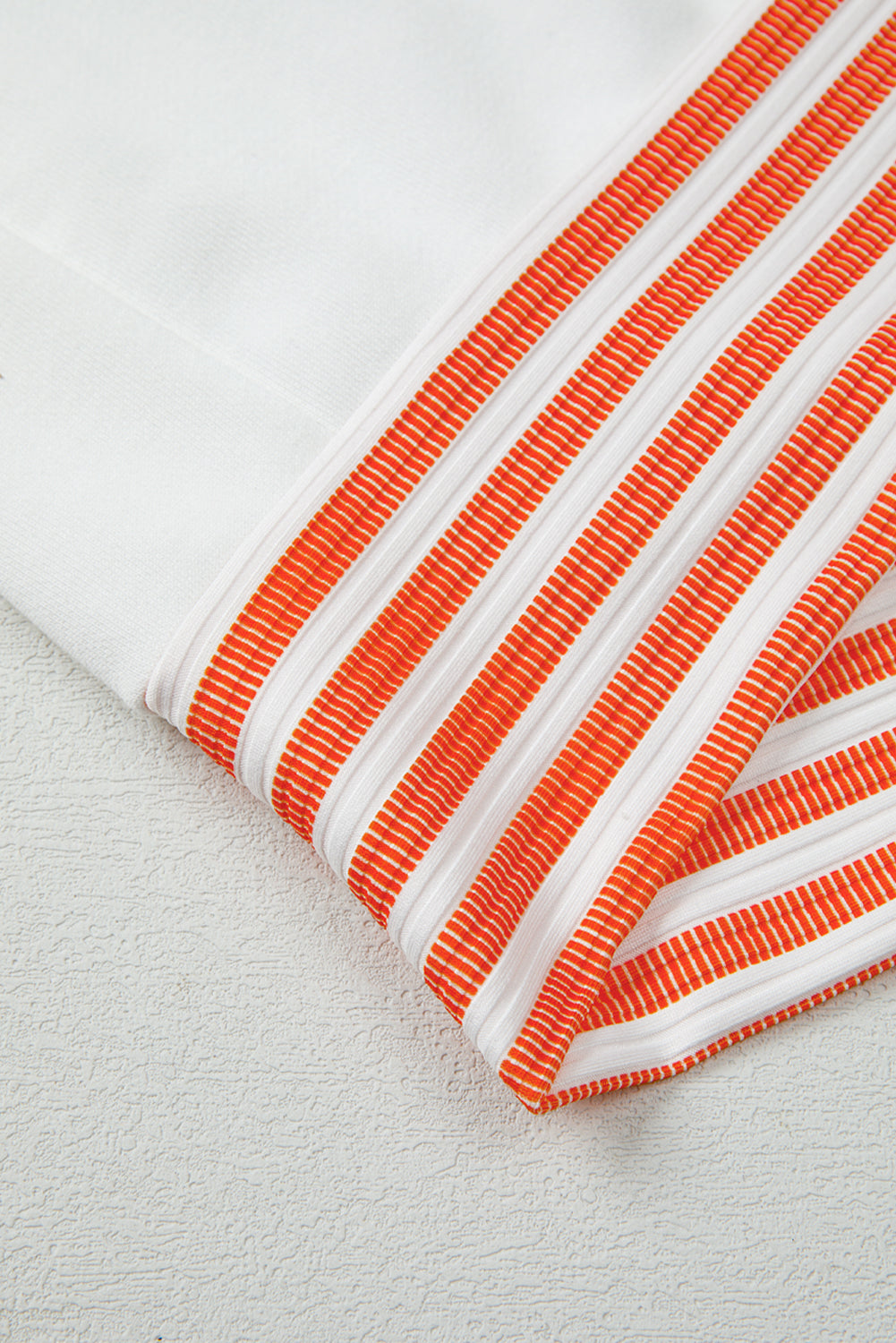 White Long Sleeve Top with Orange Striped Accents and V-Neck