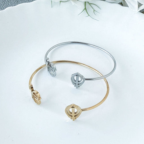 Sleek 18K gold open-cuff bangle with a minimalist, high-polish finish.
