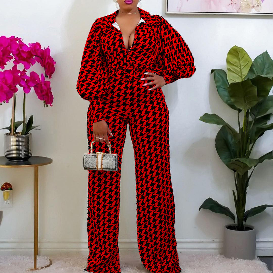 Woman wearing a modern bold red V-neck high waist jumpsuit with wide-leg silhouette