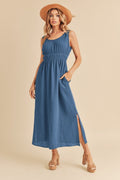 A blue sleeveless cotton tank dress with a side slit for a bohemian summer look