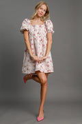Model wearing an off-white heart jacquard square neck mini dress with puff sleeves