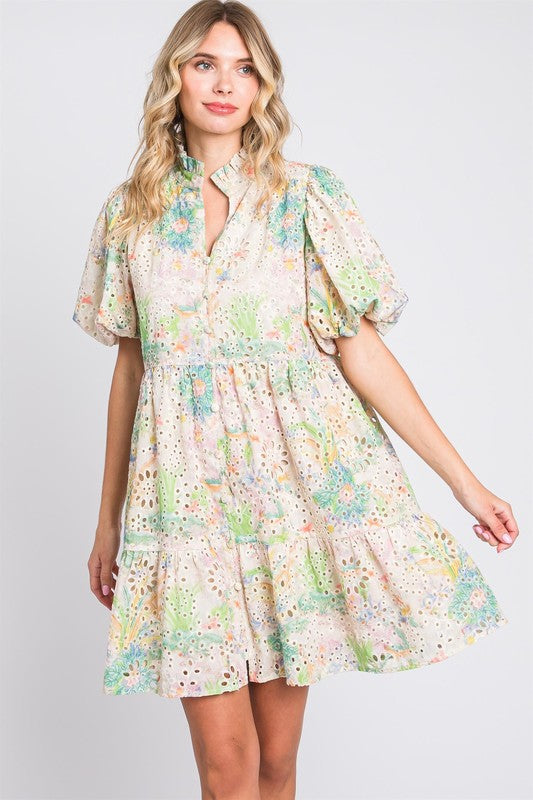 Floral eyelet lace mini dress with puff sleeves and feminine detailing.