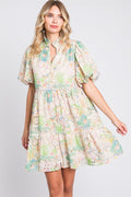 Floral eyelet lace mini dress with puff sleeves and feminine detailing.