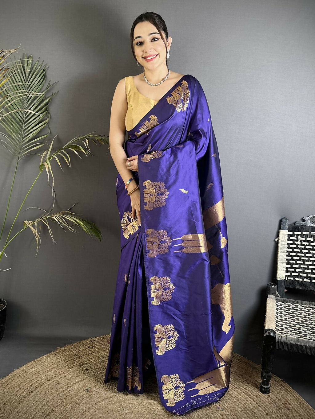 Violet soft silk Banarasi saree with gold Zari motifs and a matching polka dot blouse.