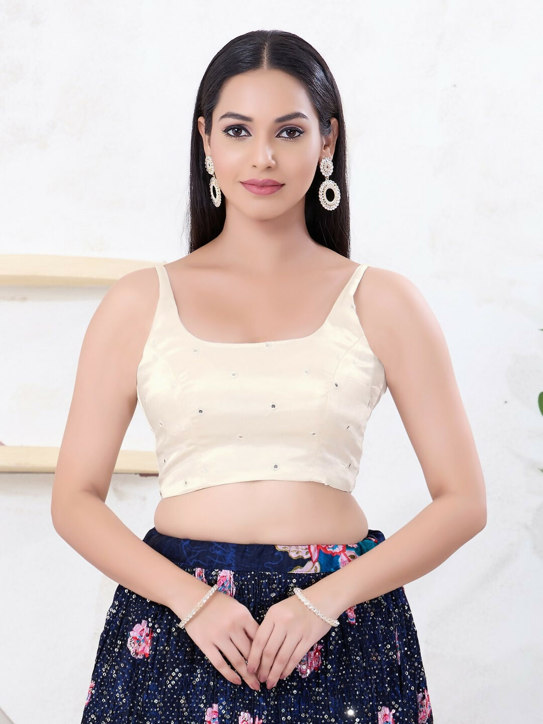 Elegant off-white sleeveless Gajji silk blouse with a square neckline and back-open design.