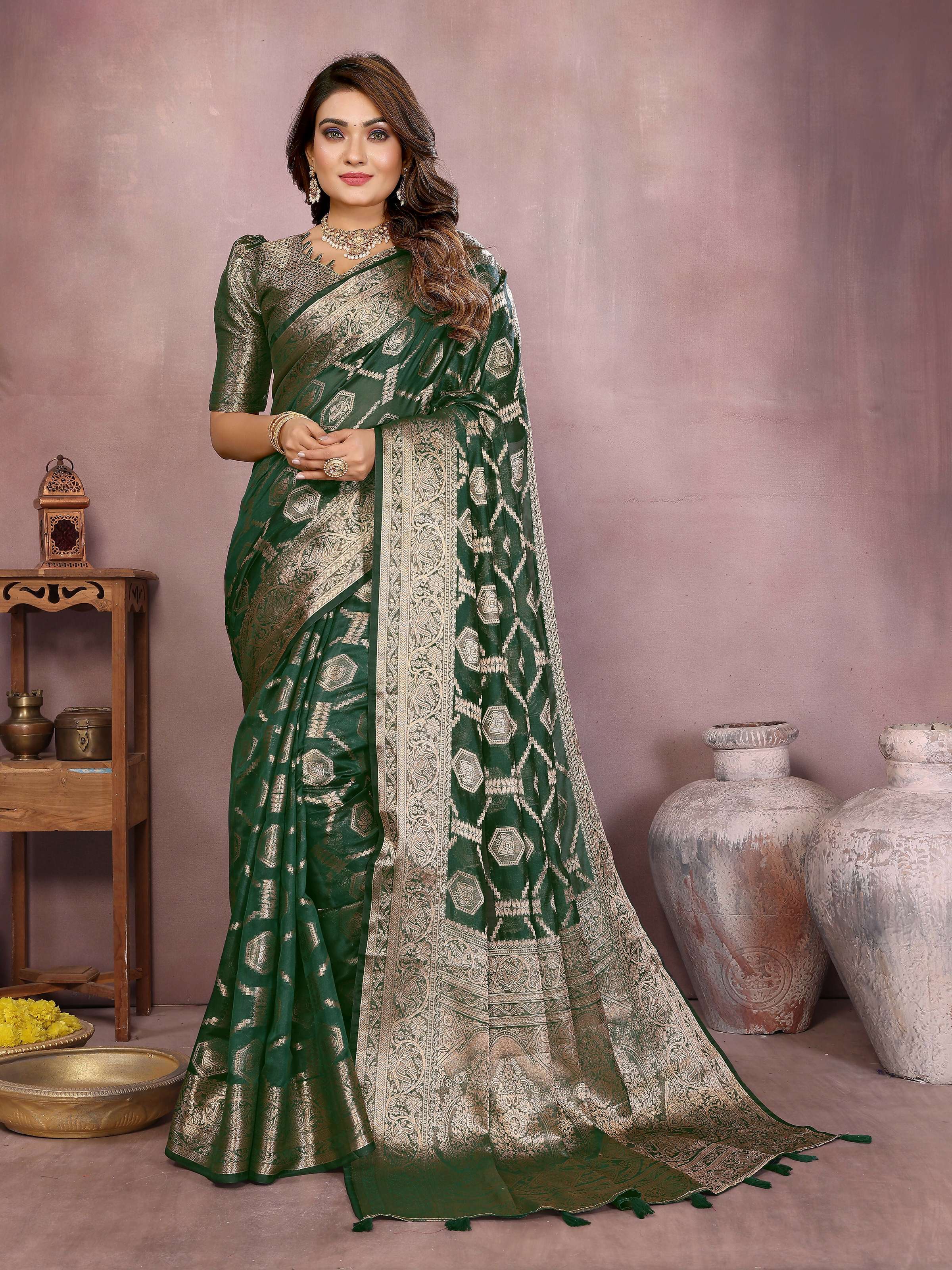 Deep green Soft Organza Silk saree with intricate weaving work