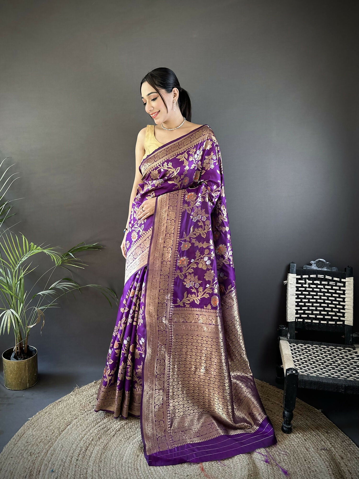 Purple soft silk Banarasi saree featuring floral and ethnic Meenakari motifs
