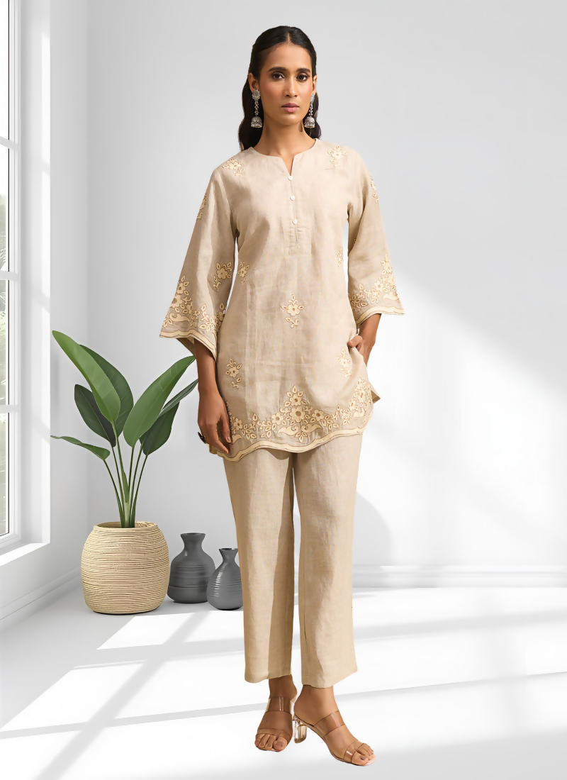 Beige linen cord set featuring delicate embroidery and a split V-neck design for festive occasions