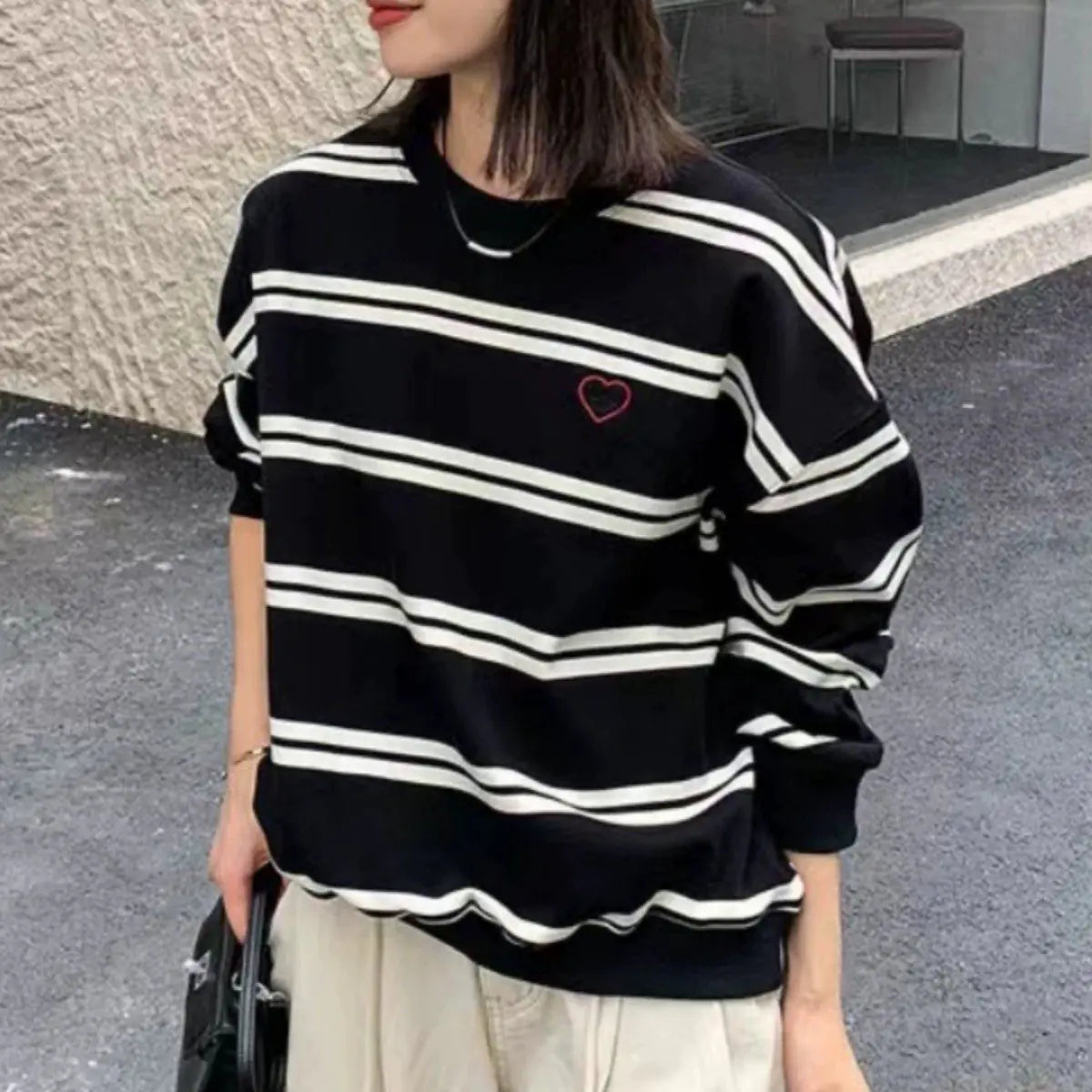 Women's Black and White Striped Pullover Sweater with Heart Detail - Image 6