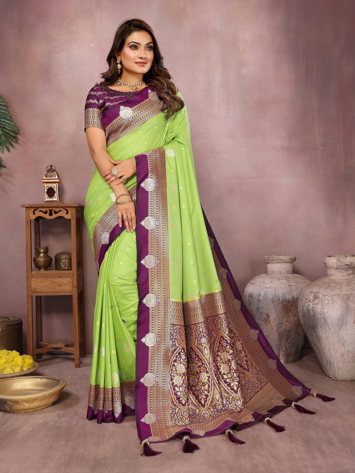 A bright parrot green silk saree featuring elegant woven patterns.