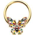 16G gold tone hinged segment ring featuring a colorful butterfly charm with inlaid red, yellow, and green enamel and sparkling clear gems.