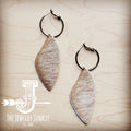Antique gold hoop earrings featuring natural tan dark hair-on-hide leather dangles on a wooden background