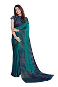 Woman wearing a teal chiffon saree with colorful abstract moire prints