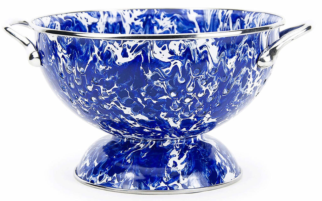 3-quart blue and white marble splatter enamelware colander on a farmhouse kitchen counter